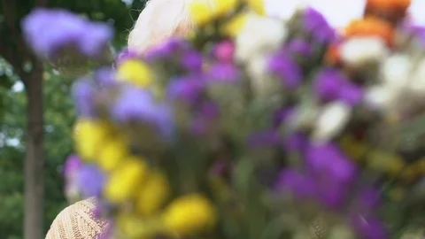 Joyful aged lady receiving field flowers bouquet on date, romantic present, love Vídeos de archivo 118993412