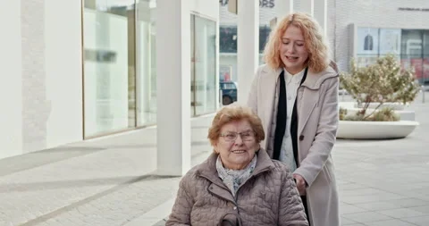 A Joyful and Meaningful Interaction Between a Caregiver and an Elderly Woman for Stock Footage 290173946