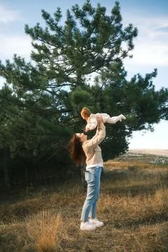 A Joyful and Uplifting Moment Shared Between a Loving Mother and Her Child in Stock Photos