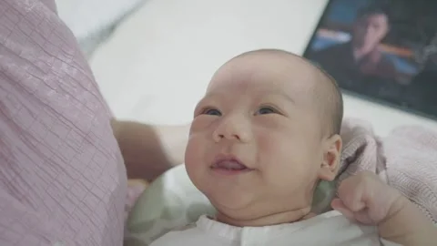 Joyful Baby Smiling While Being Held Stock Footage 318629511