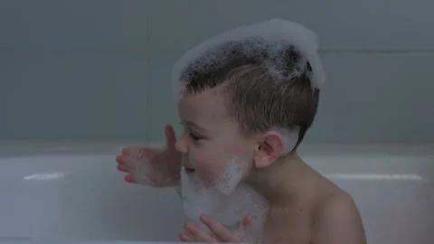 Joyful Bath Time with Bubbles A Fun and Playful Experience for Every Child and Stock Footage 312237052