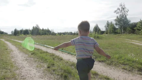Joyful boy running with a net Stock Footage 92146681