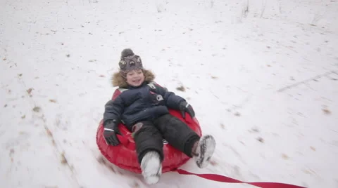 Joyful Boy Sleds on a Sledge Video stock 66256040