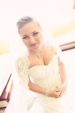 Joyful bride posing on her wedding day Stock Photos