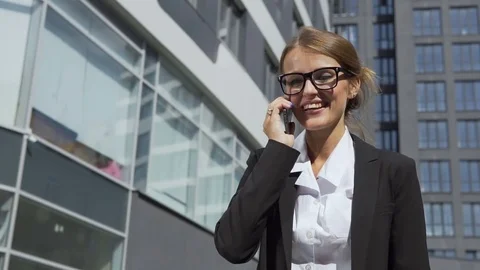 Joyful Businesswoman Talking on Phone Stock Footage