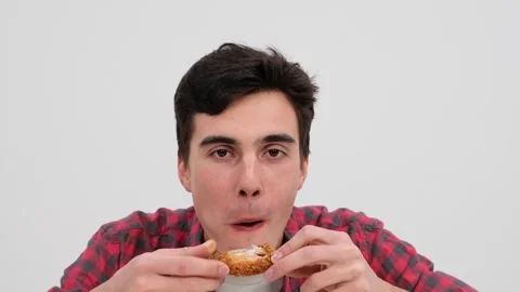 Joyful Caucasian Man Looking at Camera while Eating Chicken on White Background Stock Footage 254520600