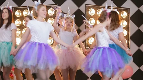 Joyful caucasian models in round dance, walk-around bride on hen party before Stock Footage 93420708