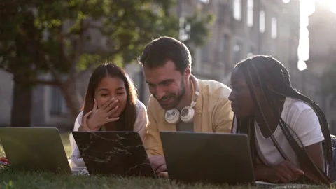Joyful classmates with laptops studying in nature Stock-Footage 163280472