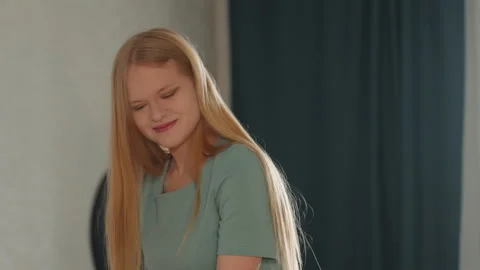 Joyful cleanup completion. Serene lady smiling post household tasks. Satisfied Vidéo 341973677