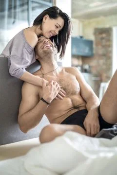 Joyful couple on bed Stock-Fotos