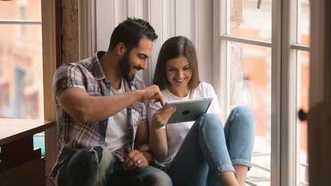 Joyful Couple Having Fun with Tablet 動画素材 91830046