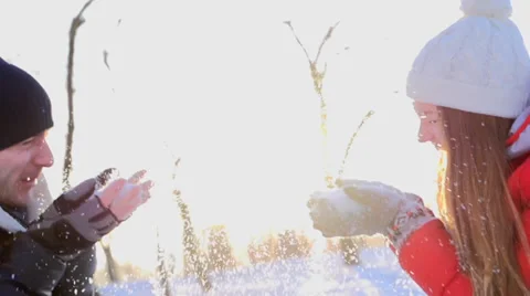 Joyful couple having fun in a winter park Stock Footage 34898216