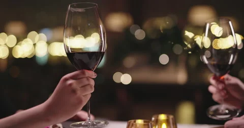 Joyful couple having a romantic dinner at a fancy restaurant. People enjoying Stock Footage 154428890