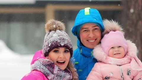 Joyful couple poses for camera and man holds little daughter 库存影片 134236861