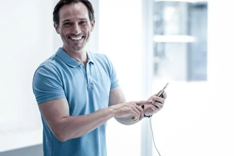 Joyful customer using a new convenient device Foto stock