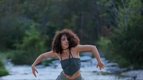 A Joyful Dance Amidst Natures Tranquility: Expressive Movements Captured in a Stock Footage 318547305