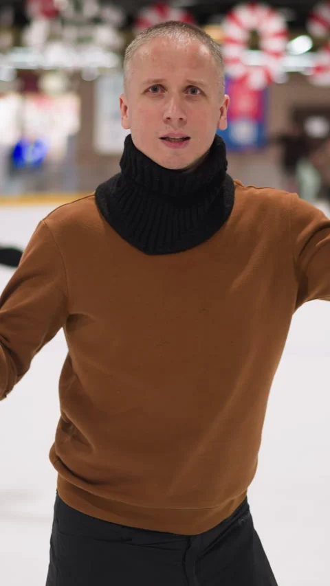 Joyful Dance at the Ice Rink with Festive Background Stock Footage 317802436