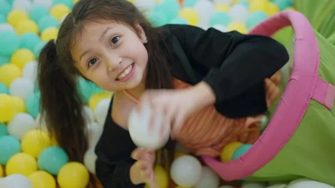 Joyful Dive into a Ball Pit 스톡 동영상 337642541