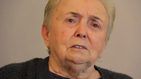 Joyful eldery woman smiling to camera Stock-Footage 107584598