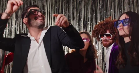 Joyful enegretic group of young people dancing to music on party, jumping and Stock Footage 340169872