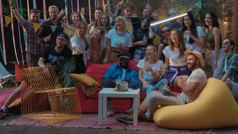 Joyful friendly young people taking group picture together posing in summer Stock Footage 114929214