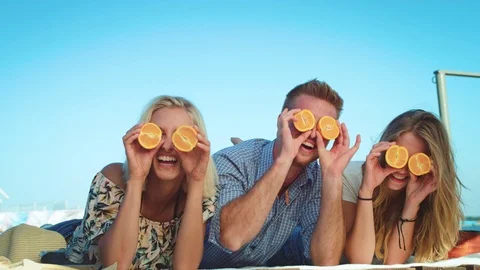 Joyful friends having fun on the beach Stock Footage 69841202