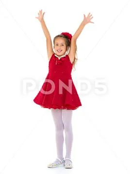 Joyful girl with arms raised. Stock Photos