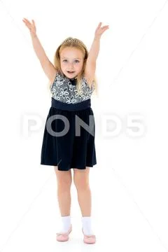 Joyful girl with arms raised. Stock Photos