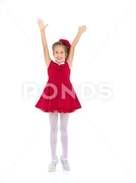 Joyful girl with arms raised. Stock Photos