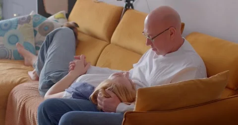 Joyful Interaction Between Generations on a Cozy Sofa Stock Footage 317341566