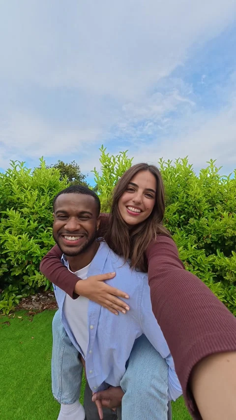 Joyful interracial couple taking selfie video Stock-Footage 334636573