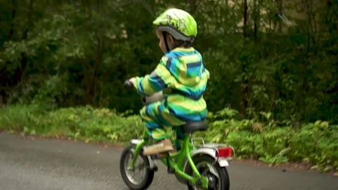Joyful Kid in Helmet Learning to Cycle for Sports Safety Stock Footage 316819393