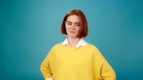 Joyful lady model poses on blue Stockbeeldmateriaal 157682644