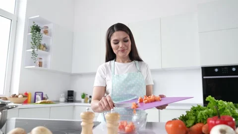 Joyful lady preparing useful dish for her family making video recipe Stock Footage 196796363