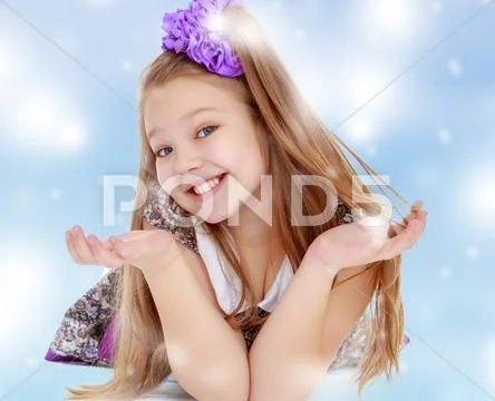 Joyful little girl lying on the floor Stock Photos