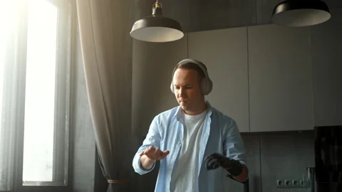 Joyful man with bio prothesis pretends playing piano Stock Footage 157349280