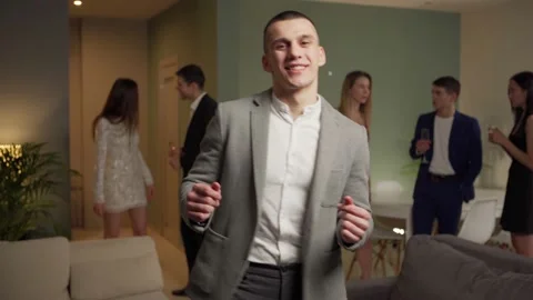 Joyful man dancing energetically at party Stock Footage 141530497