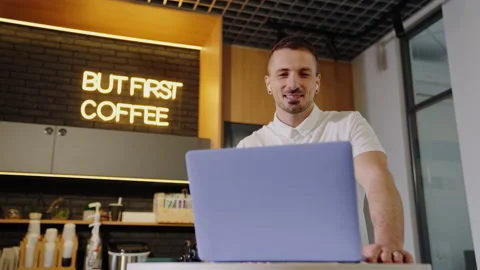 A joyful man during a video called on a laptop with colleagues Stock Footage 219460907