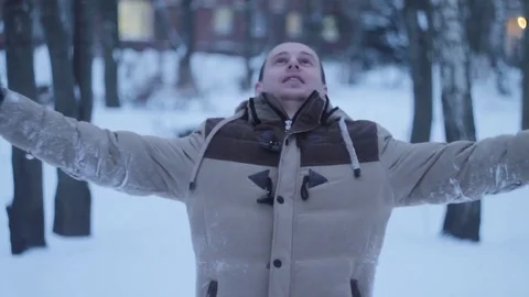 Joyful man falls in the snow Stock Footage 70679042