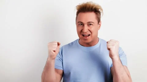 Joyful man screaming Yes raising his fists, winner gesture. Excited guy Stock Footage 235367045