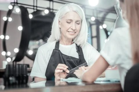 Joyful manicure master being at work Stock Photos