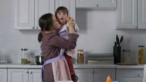 Joyful mom and special needs kid dancing in kitchen Stock-Footage 98665789