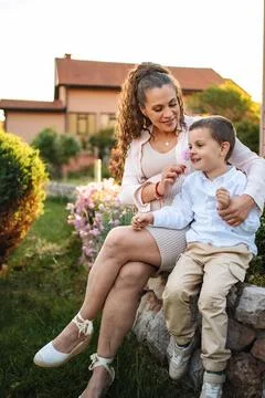 Joyful moments shared between mother and son in nature Stock Photos