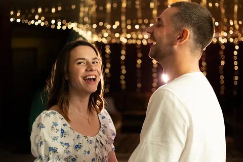 Joyful moments shared between young adults at a festive celebration Stock Photos
