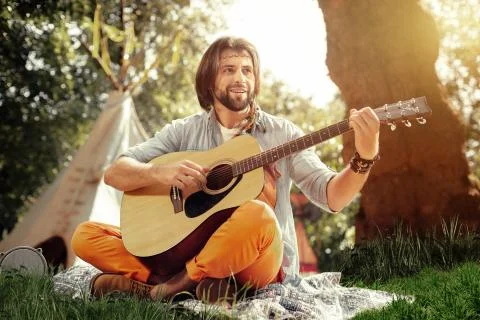 Joyful nice man creating a new melody Foto stock
