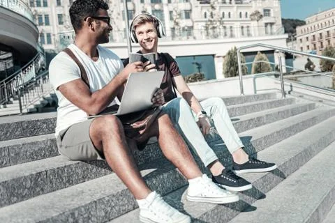 Joyful nice men drinking coffee Stock Photos