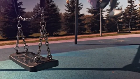 Joyful playground swing ride captures childhood fun with energy and motion Stock Footage 293958553