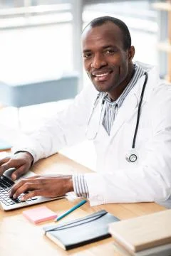 Joyful practitioner working with pleasure Stock Photos