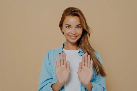 Joyful pretty model making stop sign using hands Foto stock