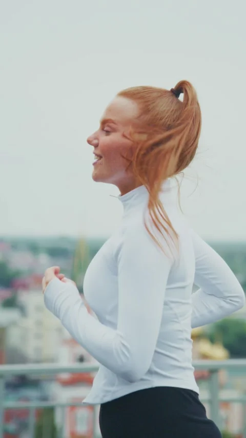 Joyful Running: Capturing the Essence of Enjoyment and Freedom as a Young Woman Stock Footage 319061675